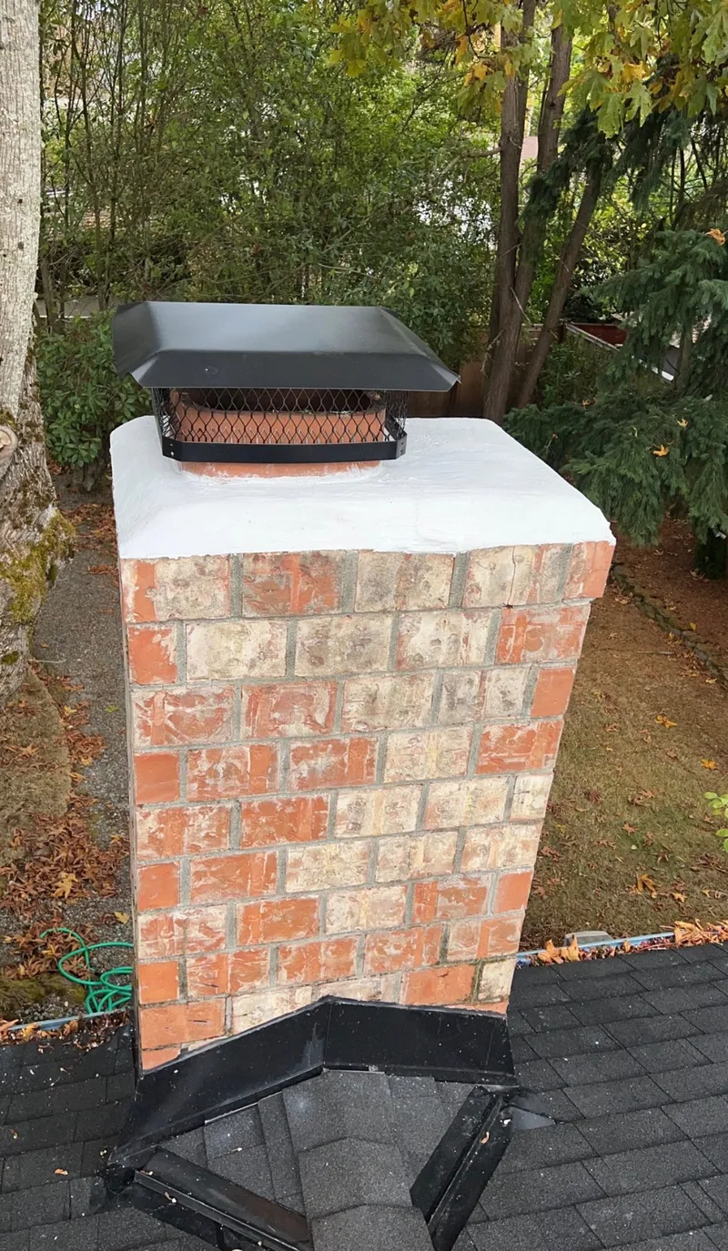 Chimney crown sealed and cap installed after repair