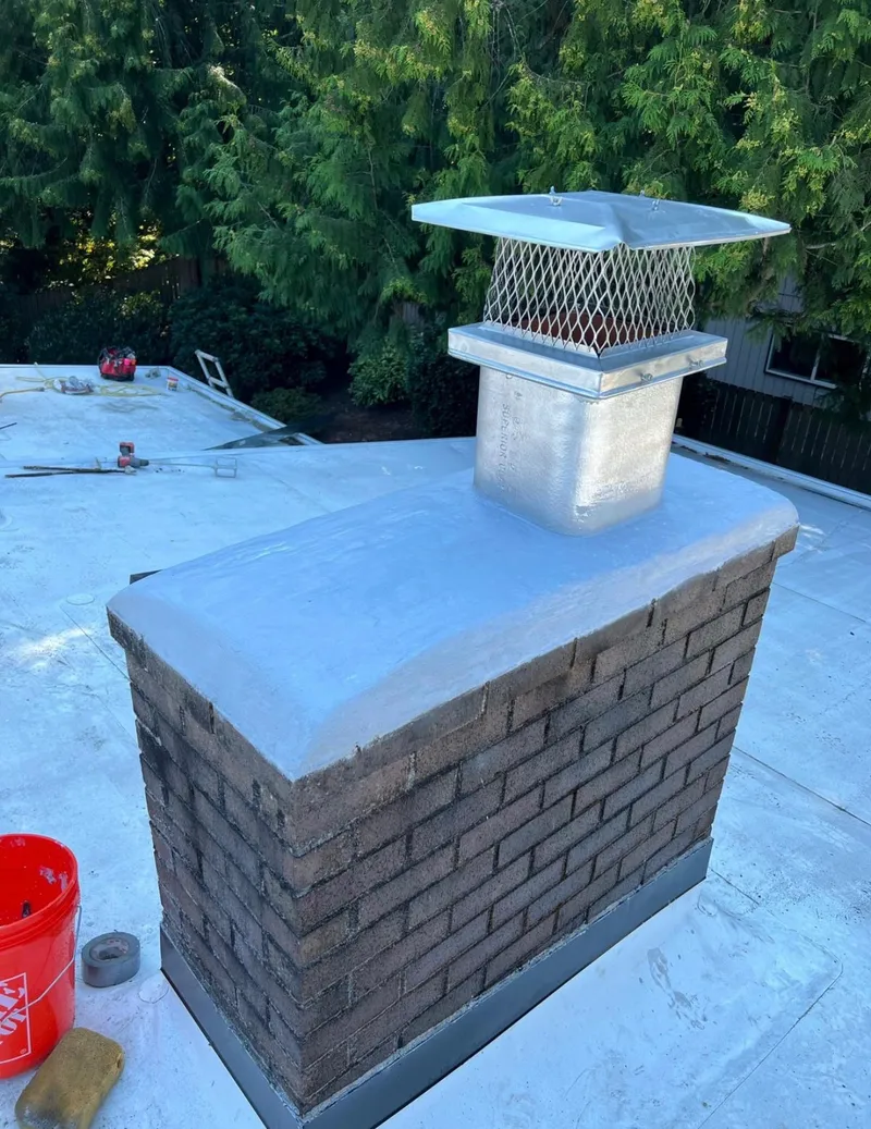 Chimney crown sealed with new cap after repair