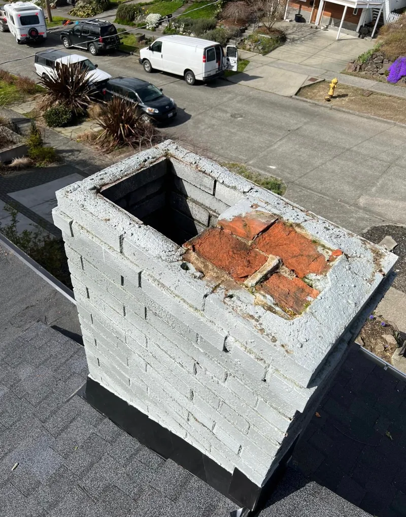 Same chimney with new crown rebuild and three new flue caps installed
