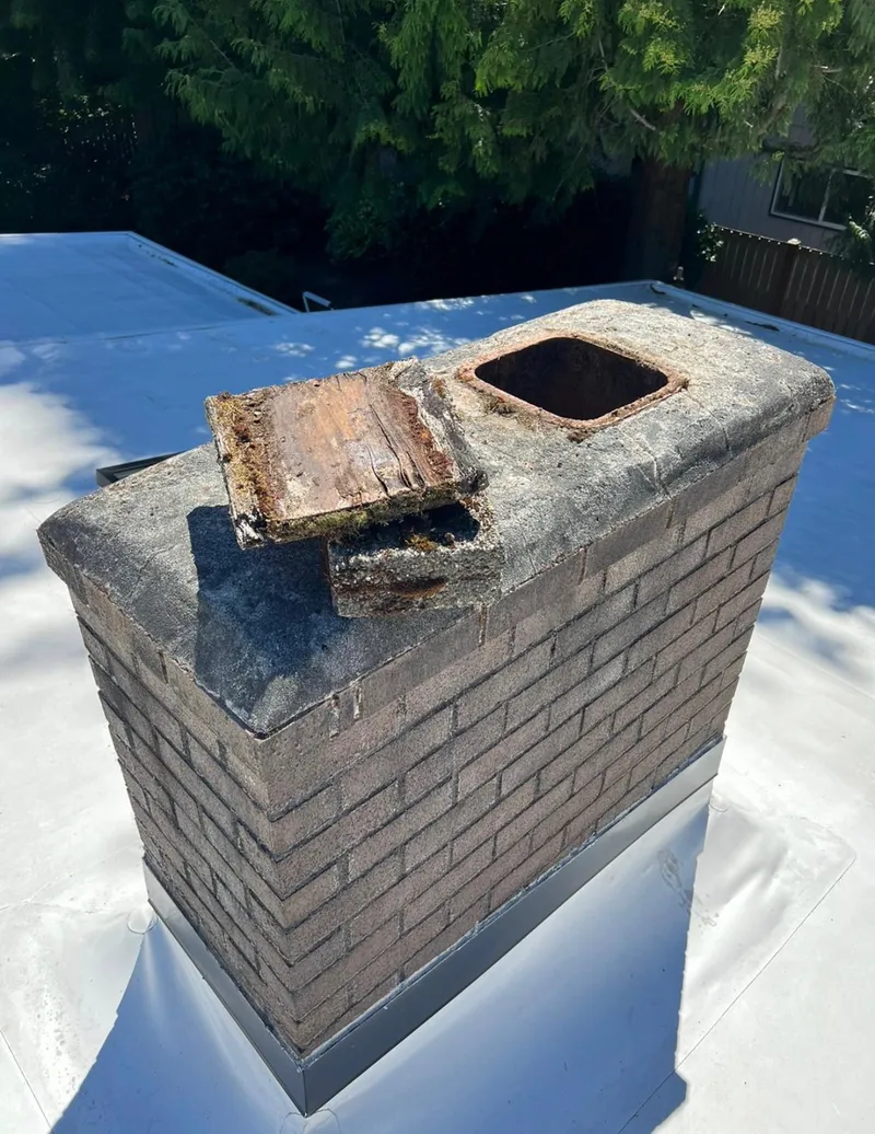 Damaged chimney crown and missing cap before repair