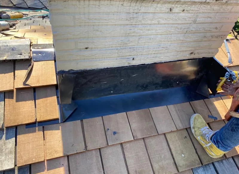 Chimney flashing repair in Seattle WA — step flashing and counter flashing reseal for Pacific Northwest roofs
