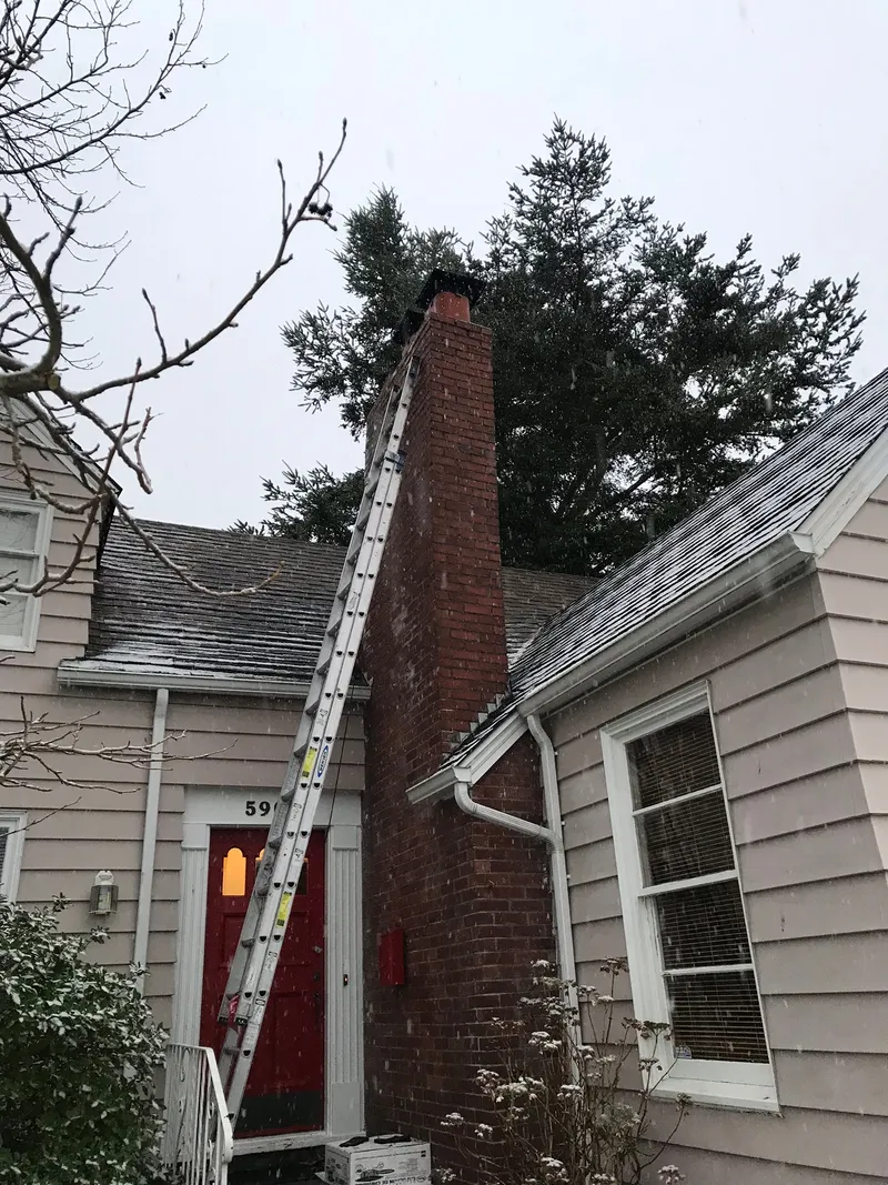 Leaning chimney repair in Seattle WA — foundation stabilization and masonry rebuild for seismically damaged chimneys