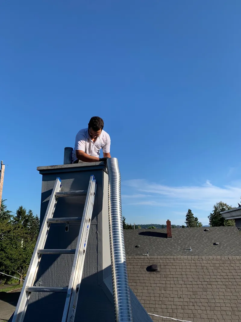Chimney liner installation in Seattle WA — stainless steel relining for pre-war clay tile and oil-to-gas conversion chimneys