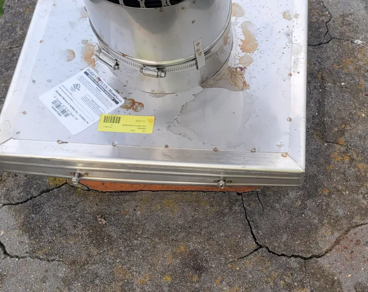 Cracks in the chimney crown — chimney repair warning sign
