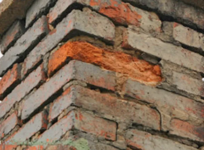 Crumbling or missing mortar — chimney repair warning sign